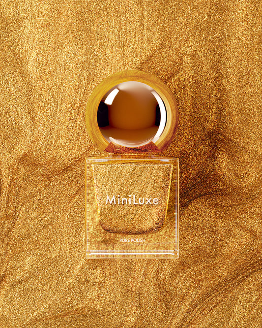 MiniLuxe clean nail polish Festive gold bottle gold background