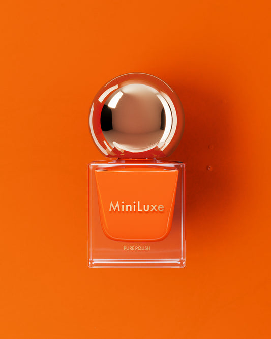 MiniLuxe Pure Polish Citrine orange bottle orange background