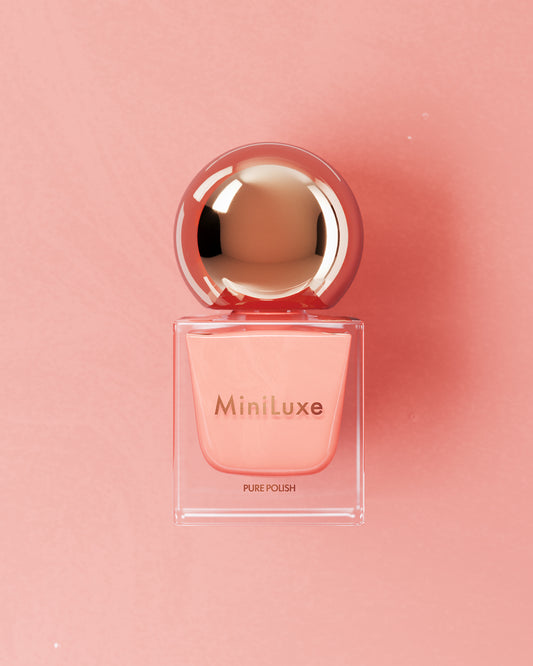 MiniLuxe clean nail polish Eden Roc pink bottle pink background