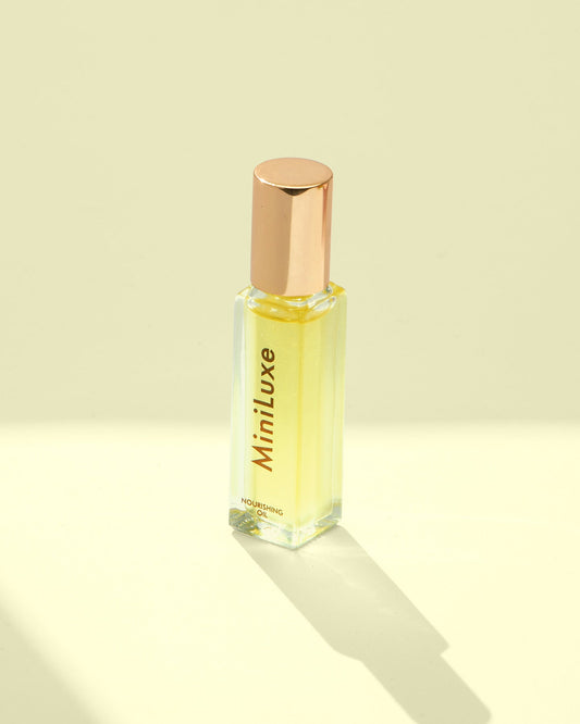 MiniLuxe Cuticle Oil Rollerball on yellow background